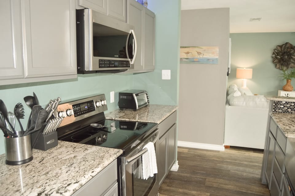 Your fully equipped kitchen features granite countertops, stainless steel appliances, and everything you need to create memorable meals during your stay.