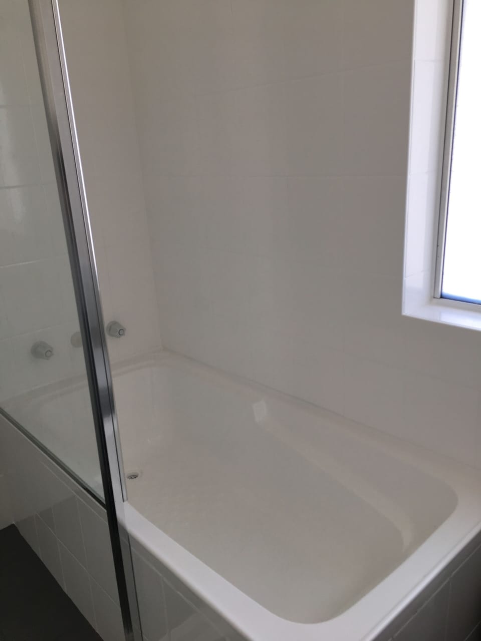 Bathroom has Separate shower and bathtub with toilet and vanity 