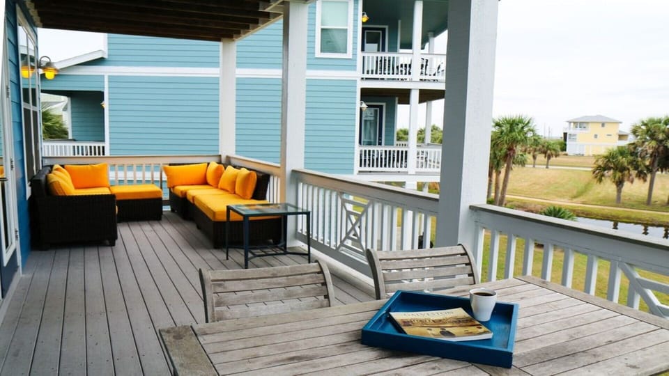 Teak wood table seats 3 on spacious 2nd floor balcony with great water views!