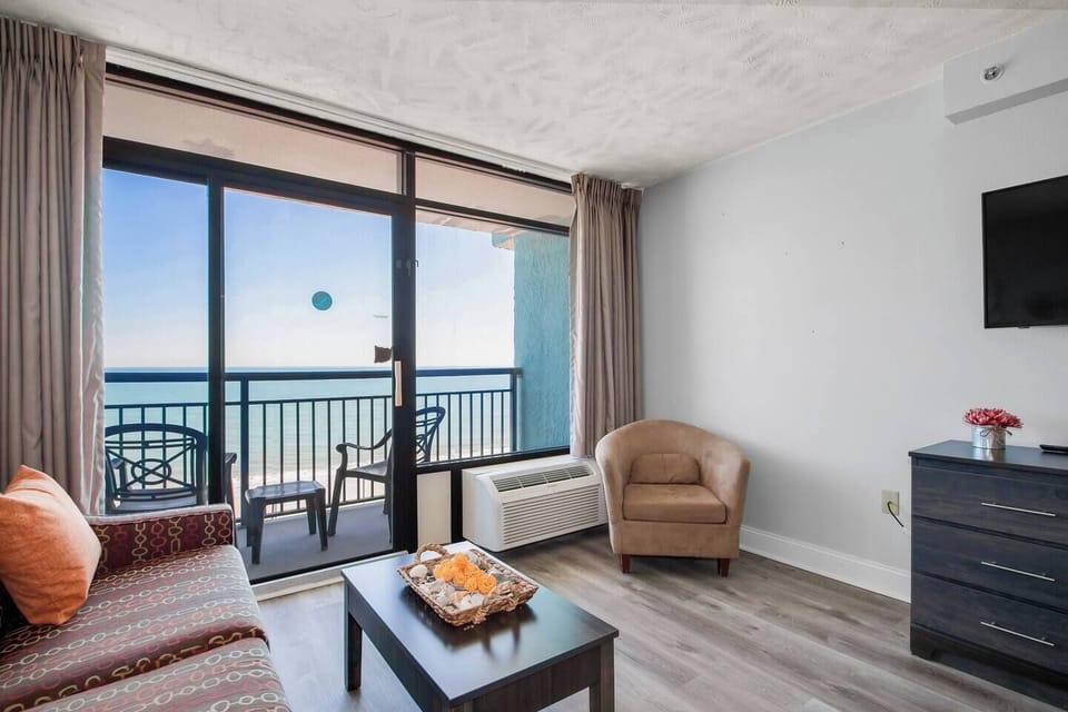 Immerse yourself in breathtaking ocean views framed by expansive windows. The living area serves as your front-row seat to the ever-changing beauty of the sea, creating a serene backdrop for relaxation.