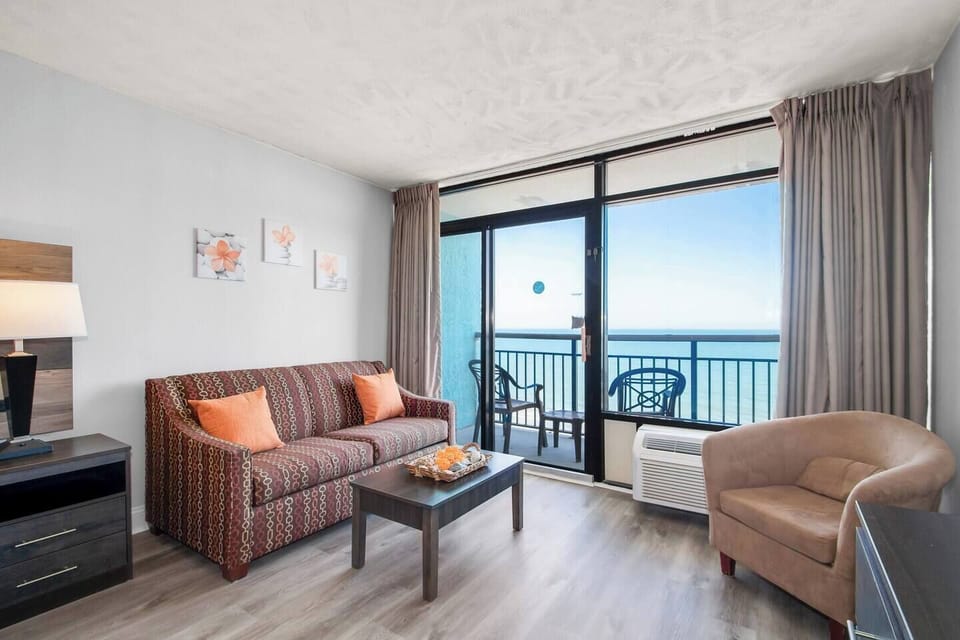 Immerse yourself in breathtaking ocean views framed by expansive windows. The living area serves as your front-row seat to the ever-changing beauty of the sea, creating a serene backdrop for relaxation.