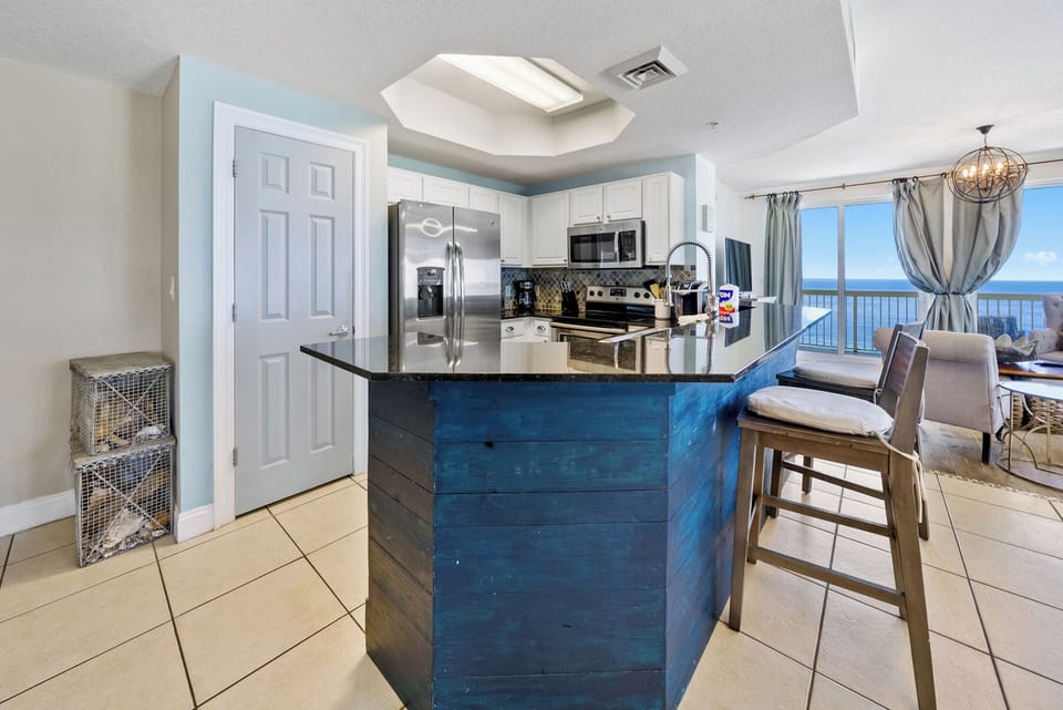 Your fully-equipped kitchen with stunning ocean views lets you prepare meals while watching waves crash below.