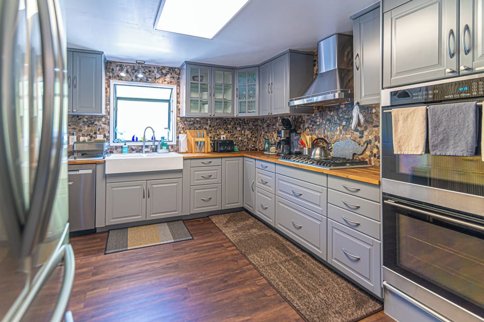 The fully equipped kitchen is designed for effortless vacation dining, featuring modern appliances, ample counter space, and everything needed to prepare anything from morning coffee to family feasts.