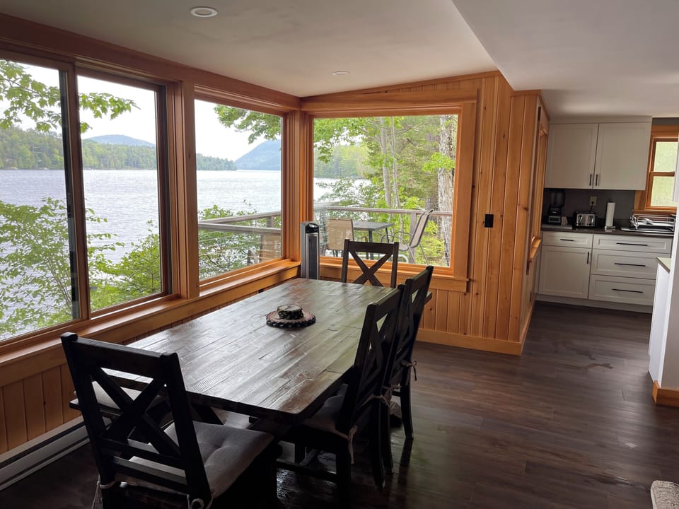 Dining area over lake toward kitchen