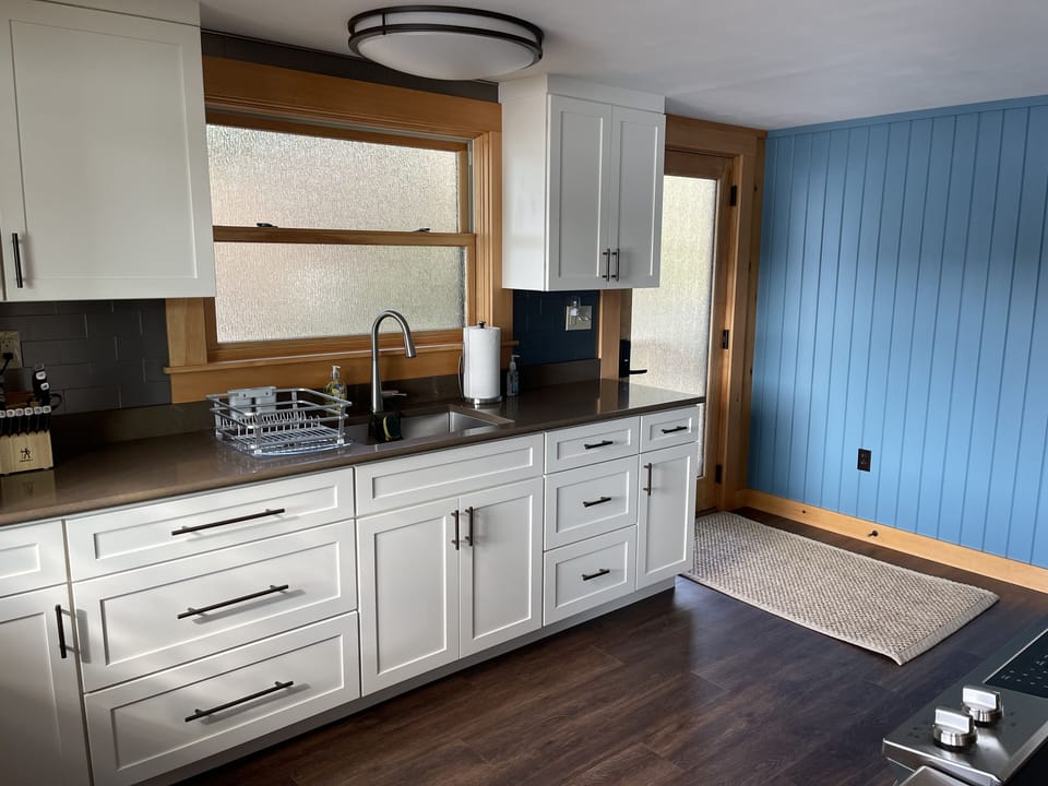 Kitchen has new dinnerware, flatware, glassware, and kitchenware