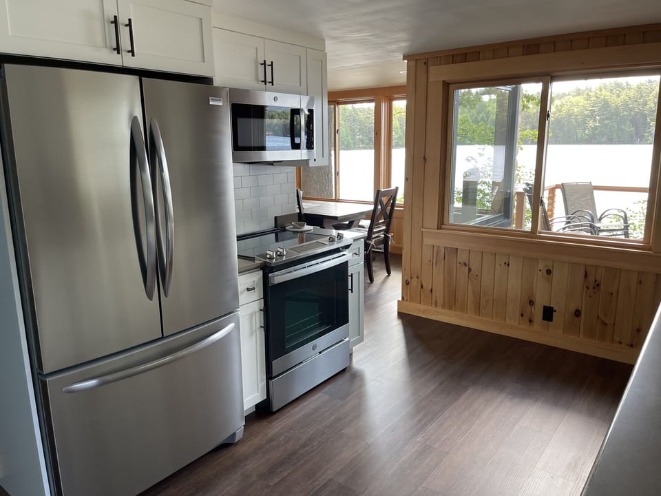 Kitchen features new stainless fridge, stove and microwave