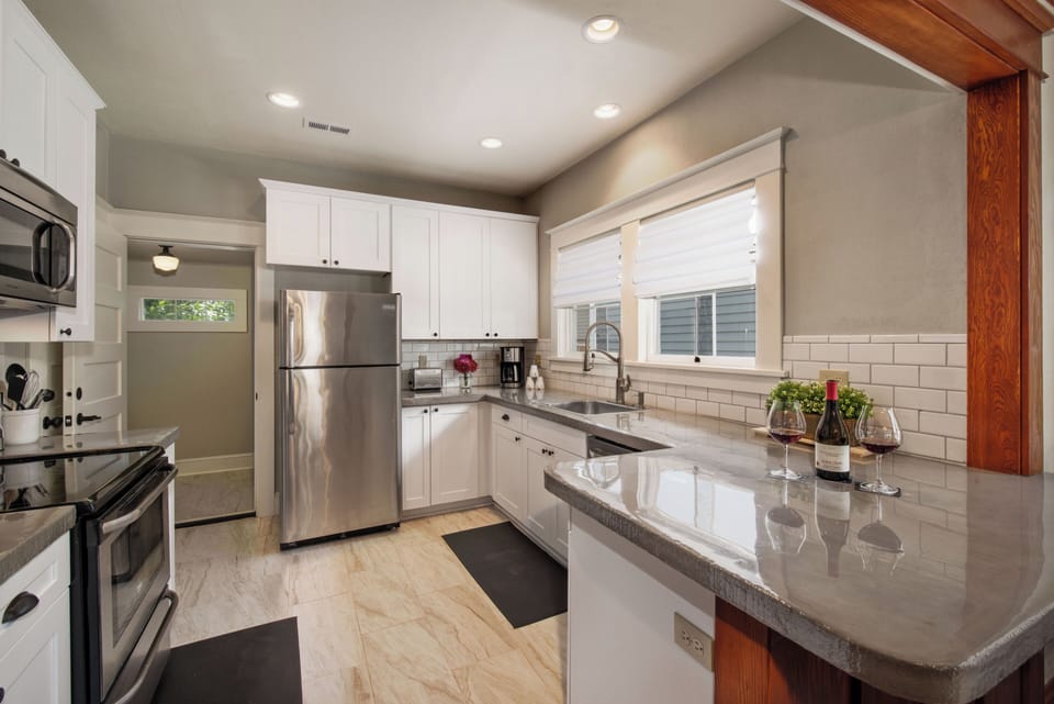 Kitchen | Fully Stocked | Eating Bar | Built-in Microwave | Stove-Oven
