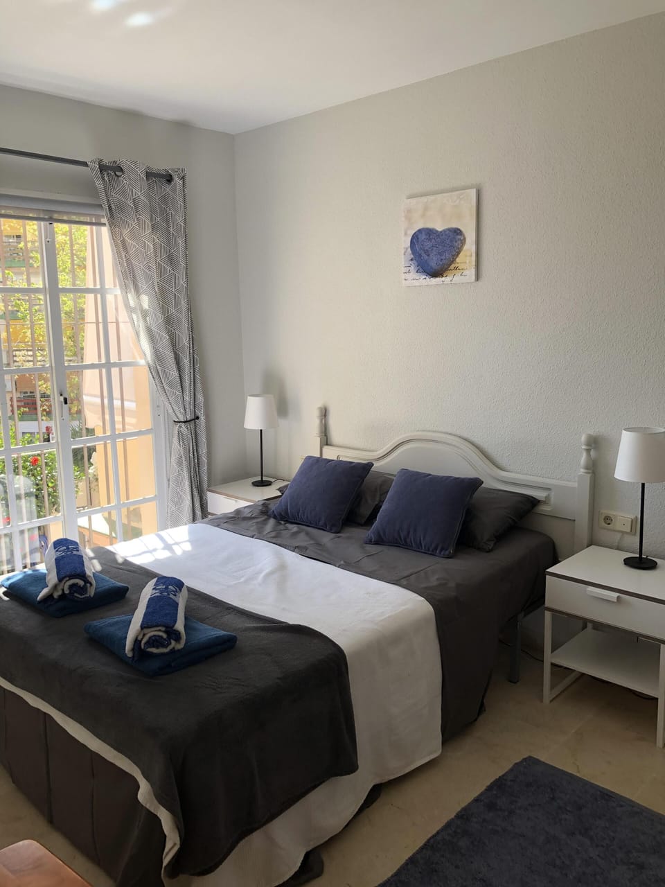 Double bedroom with fitted  wardrobe drawers and air con unit 