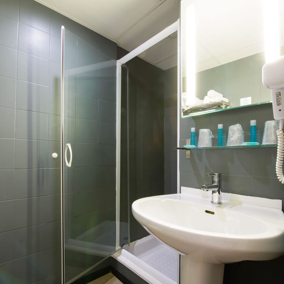 Shower, free toiletries, hair dryer, towels