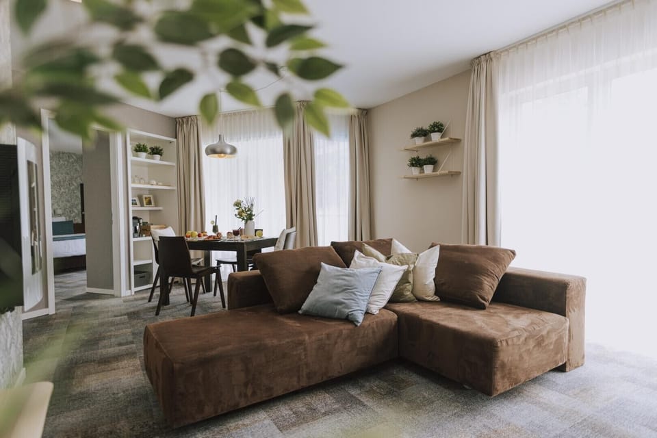 Deluxe Suite with Balcony | Living area | LCD TV, pay movies
