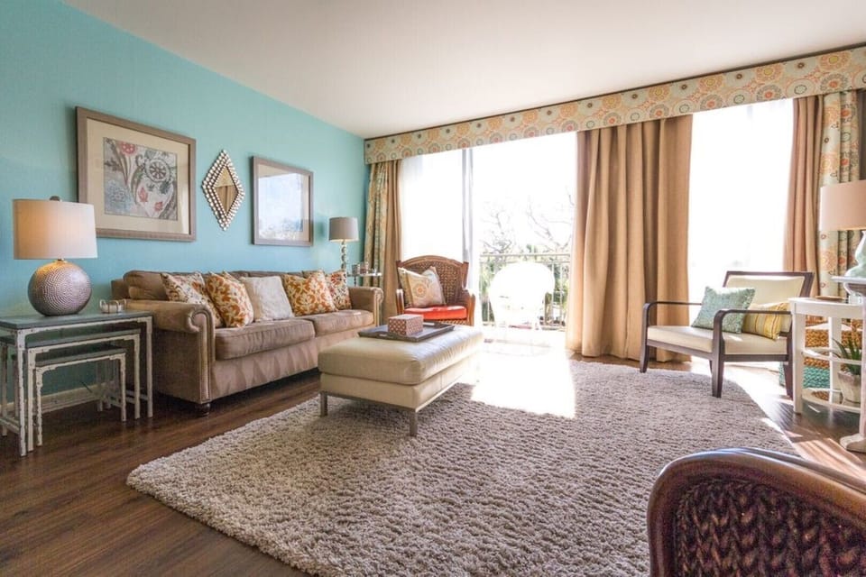 Family Room with 1 of the 2 balconies and morning sun!