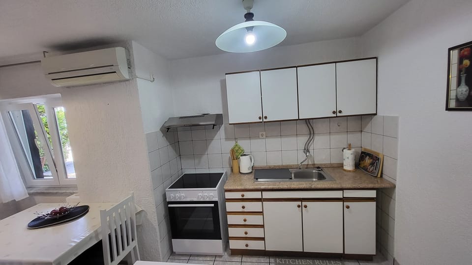 Apartment (A1) | Private kitchen | Fridge, microwave, stovetop, coffee/tea maker