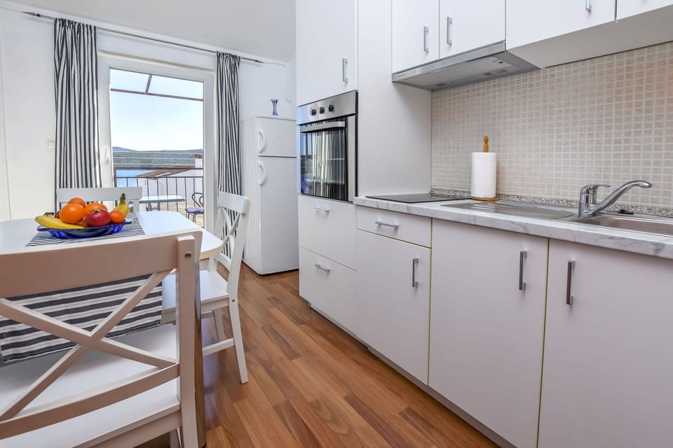 Apartment (A2) | Private kitchen | Fridge, stovetop, electric kettle, toaster