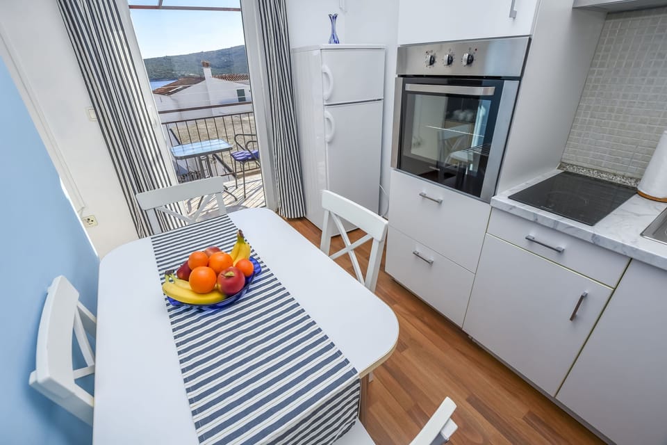 Apartment (A2) | Private kitchen | Fridge, stovetop, electric kettle, toaster