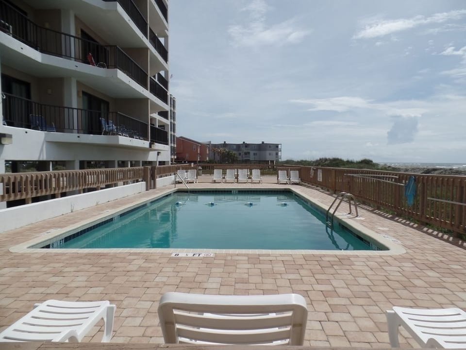 Swimming pool is huge and over 8 feet deep at one end.