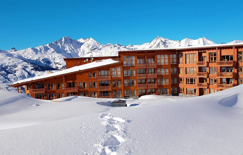 Enjoy stunning surrounding mountain views from your cozy suite.