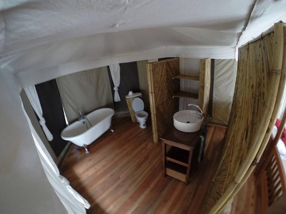 Deep soaking tub, rainfall showerhead, hair dryer, towels