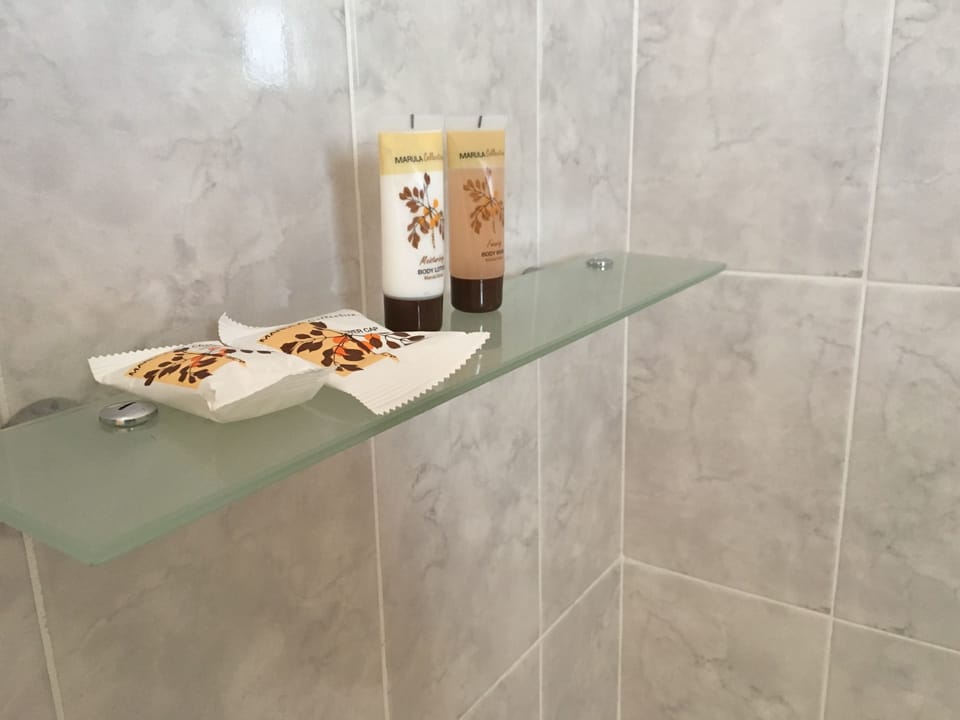 Deep soaking tub, rainfall showerhead, free toiletries, towels