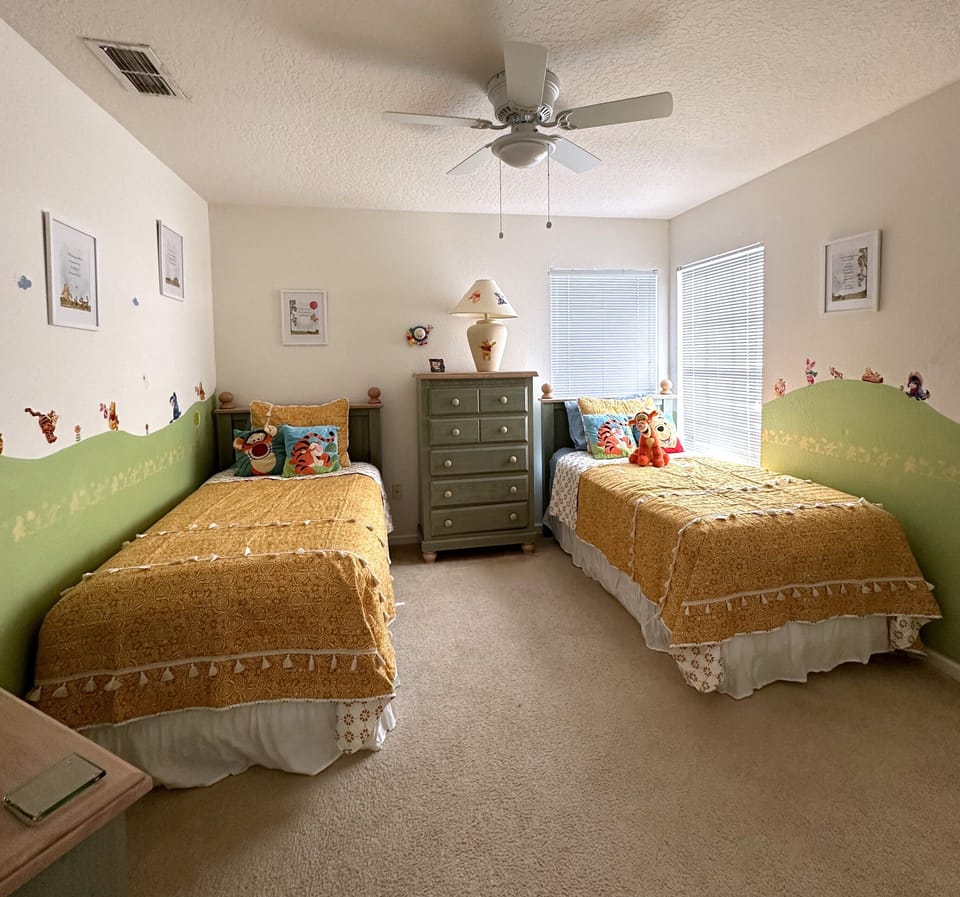 2 Twins room upstairs with playful Winnie the Pooh design