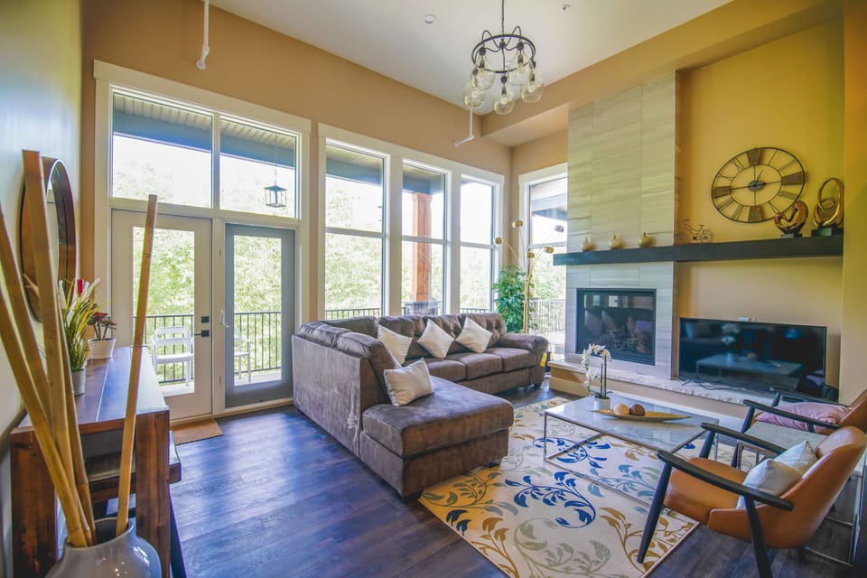 mountain view living room with balcony and patio
