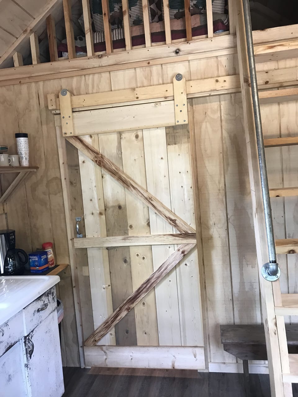 Beautiful barn doors keep bedrooms private.