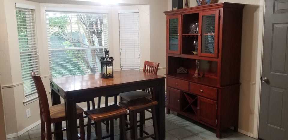 Kitchen nook with access to garage.   Great bird watching out of this window.