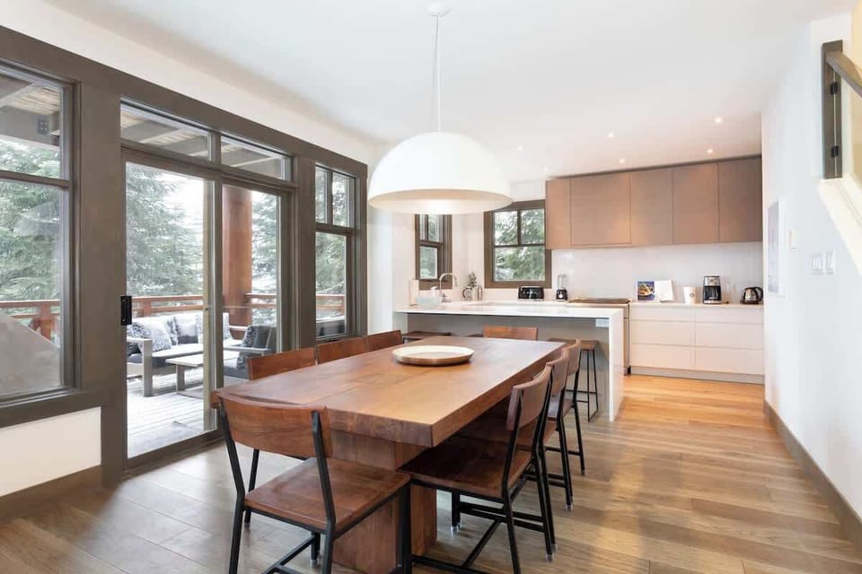 - Open dining and kitchen area for family gatherings  
- Whistler chalet with bright interiors and modern design  
- Perfect alpine home for group stays and celebrations
