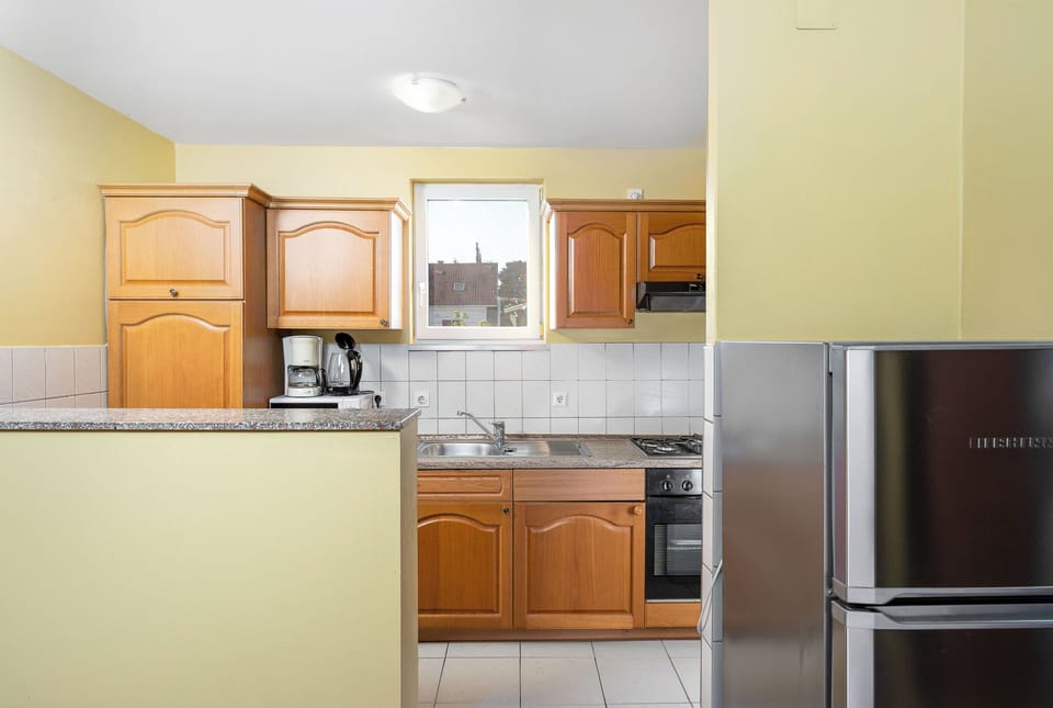 Apartment (A3) | Private kitchen | Fridge, microwave, oven, stovetop