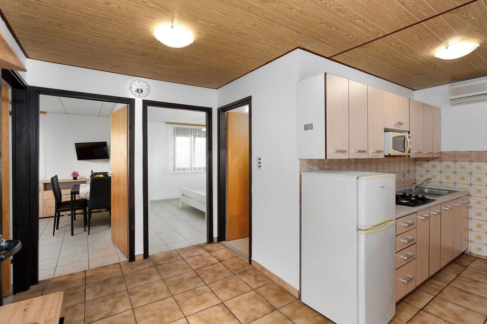 Apartment (A2) | Private kitchen | Fridge, microwave, oven, stovetop