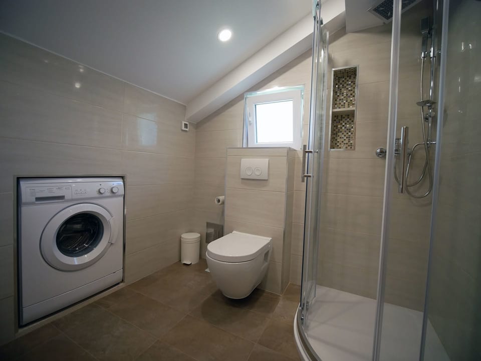 Bathroom | Shower, free toiletries, hair dryer, toilet paper
