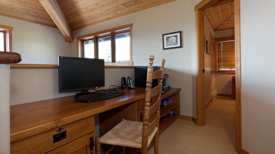 - Dedicated workspace with wooden desk and natural light  
- Perfect for remote work or planning your next adventure  
- Serene setup blending productivity with mountain tranquility  