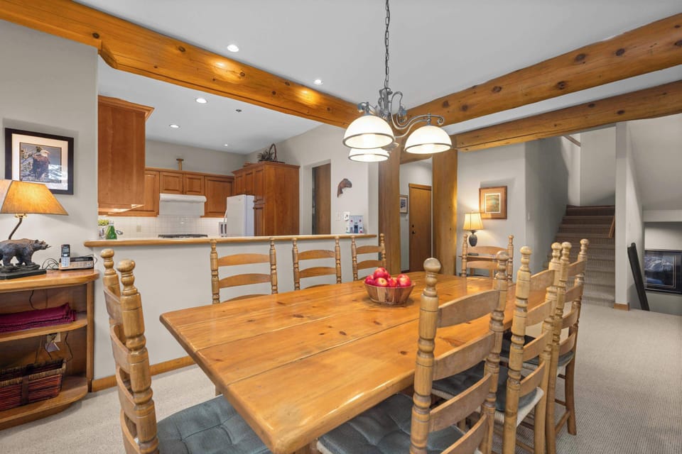 - Dining area blending comfort and cabin-style elegance for gatherings  
- Open layout connects to kitchen for easy serving and shared meals  
- Great for family dinners and evenings spent together indoors  