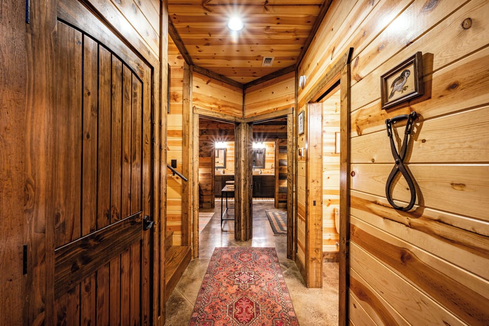 Hallway To Dual Grand Suites Including Half Bath Immediately To Right