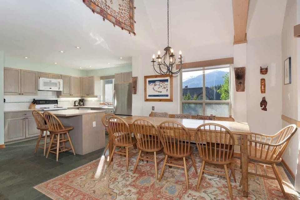 - Elegant dining space for large family meals  
- Bright natural light with forest view charm  
- Perfect for cozy gatherings and celebrations  
