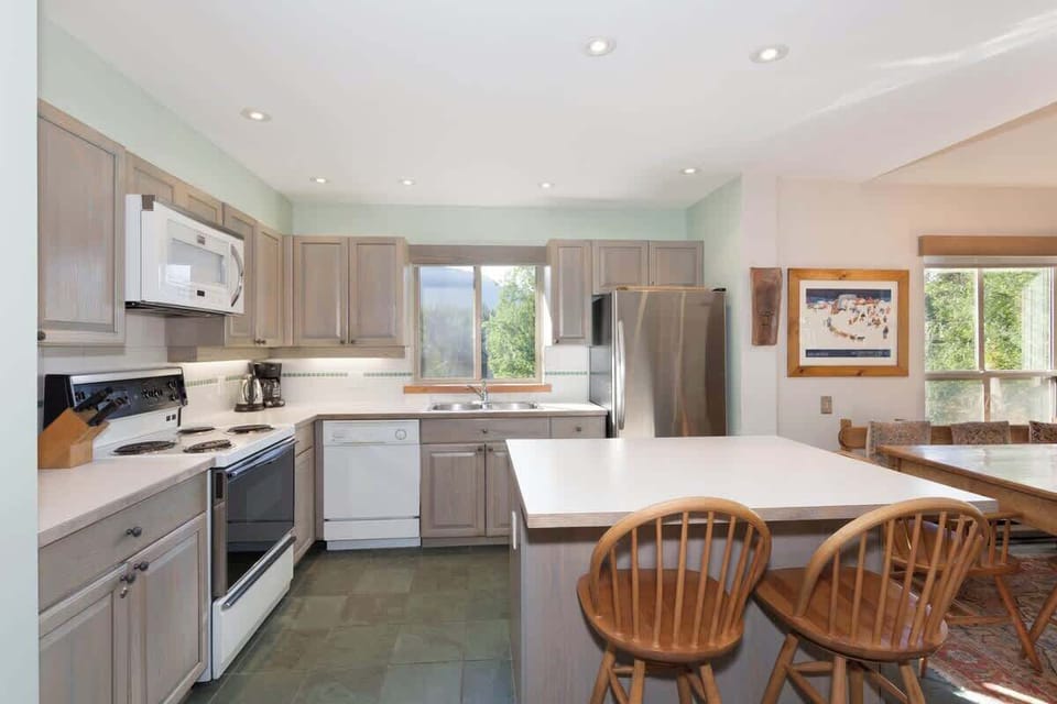 - Modern kitchen with full appliances ready  
- Bright space perfect for family cooking fun  
- Overlooks forest and mountain serenity  
