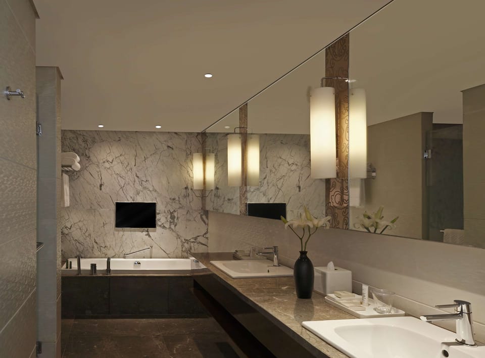 Executive Suite, 1 King Bed | Bathroom | Separate tub and shower, deep soaking tub, rainfall showerhead