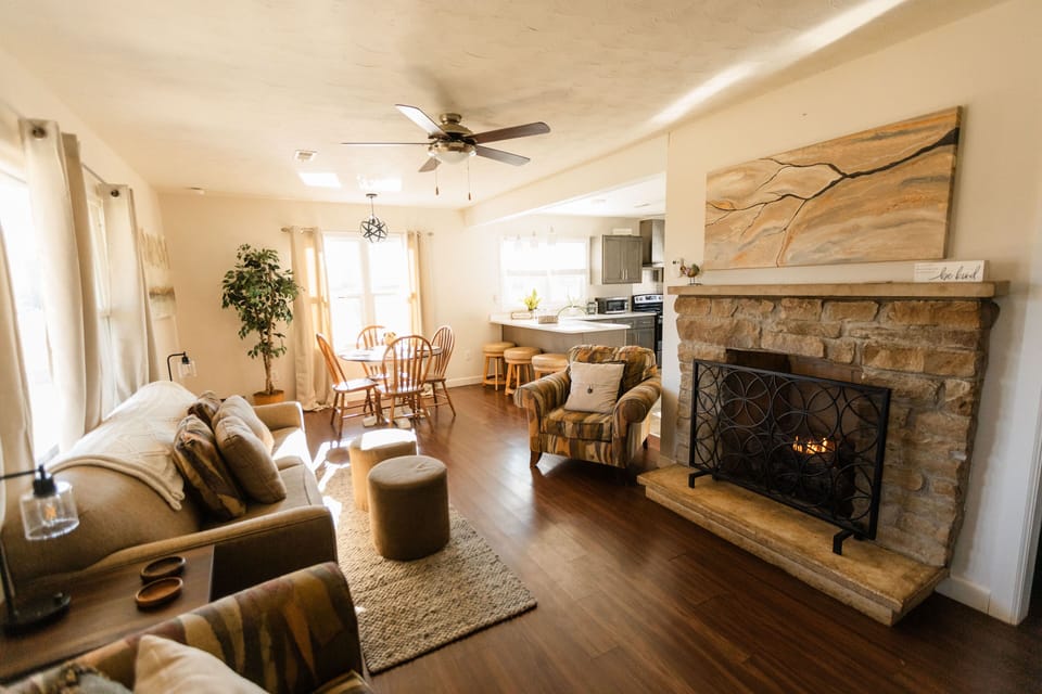 living room with plenty of seating, couch pulls out to queen size sleeper sofa