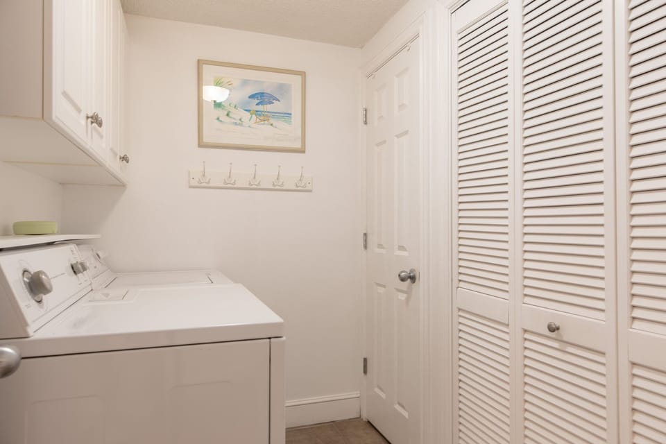 Laundry room with full size washer and dryer.
