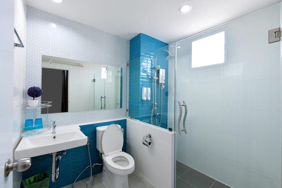 Shower, rainfall showerhead, hair dryer, towels