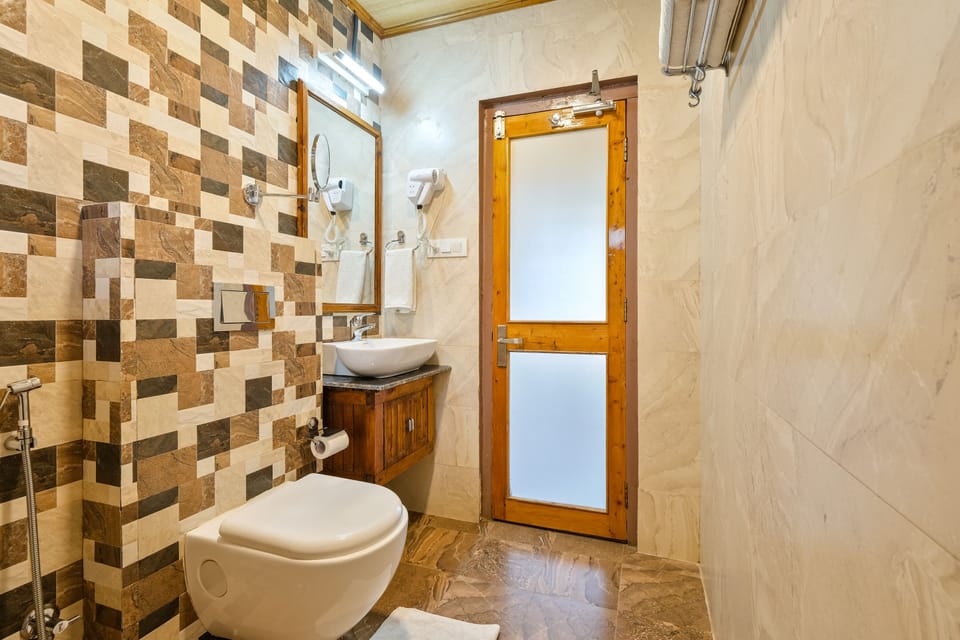Economy Cottage | Bathroom | Shower, slippers, towels