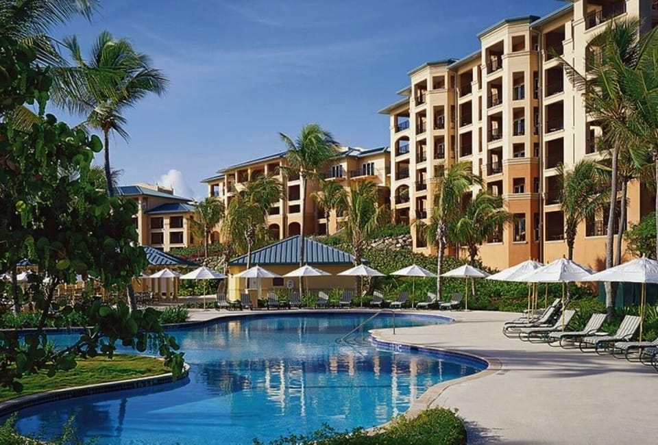 Club Pool with abundant loungers and umbrellas