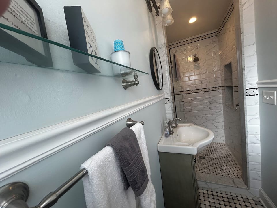 Premier Queen Room with Fireplace | Bathroom | Deep soaking tub, free toiletries, hair dryer, towels