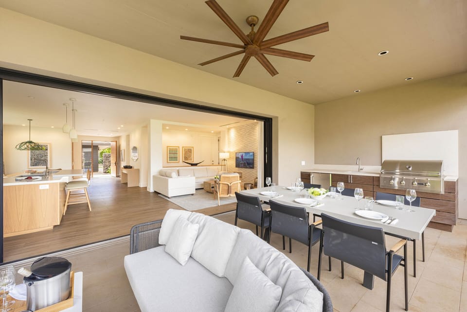 Lanai space with BBQ, outdoor eating area, outdoor furniture.  Resort view.