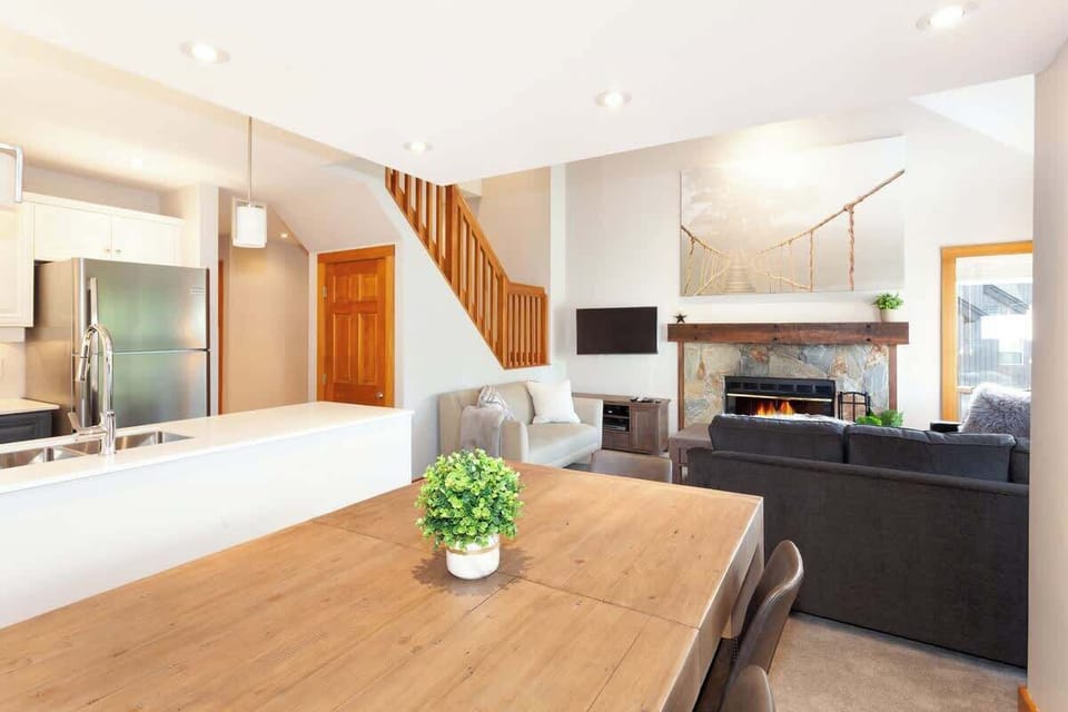 - Open-concept Whistler townhome with modern interiors  
- Cozy fireplace and inviting seating for families  
- Steps away from slopes and Whistler Village nightlife  