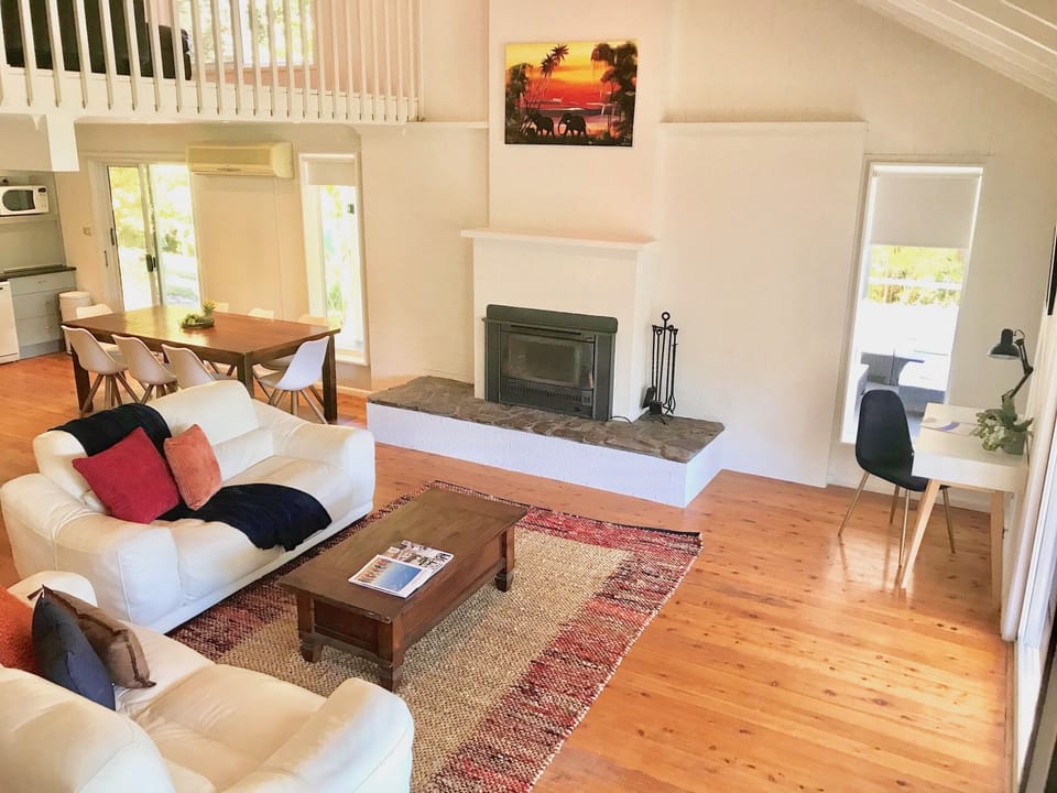 Downstairs lounge with wood burning fireplace