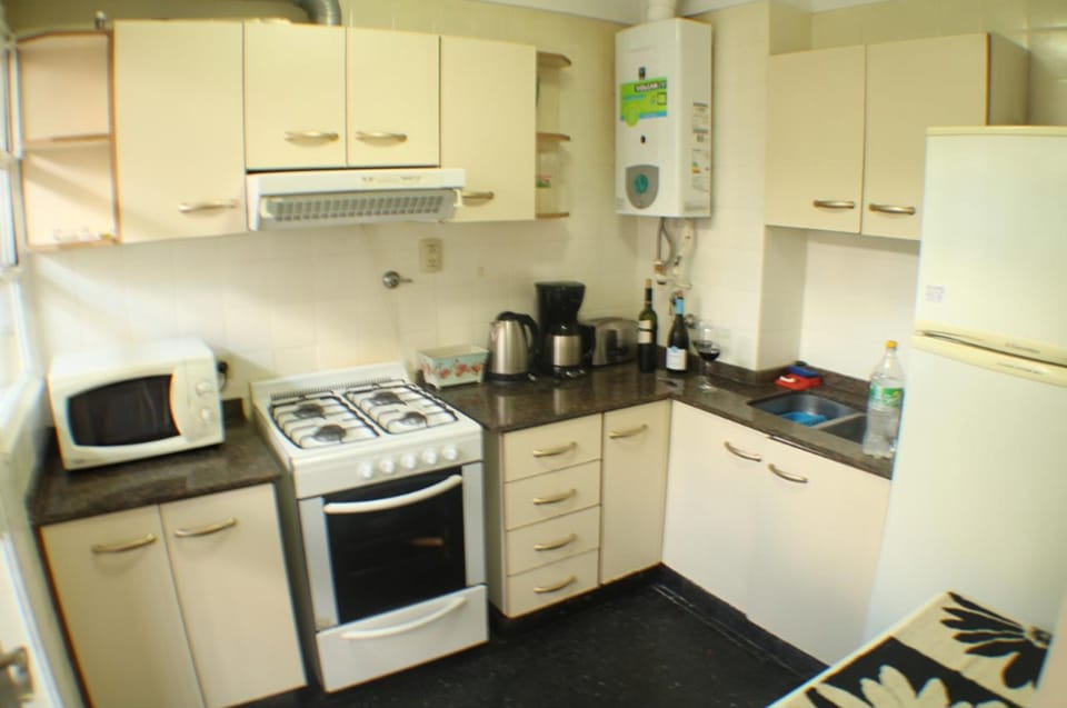 Apartment, Balcony | Private kitchen | Full-size fridge, microwave, oven, stovetop
