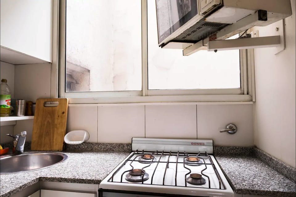 Design Apartment, Garden View | Private kitchen | Fridge, microwave, cookware/dishes/utensils, cleaning supplies