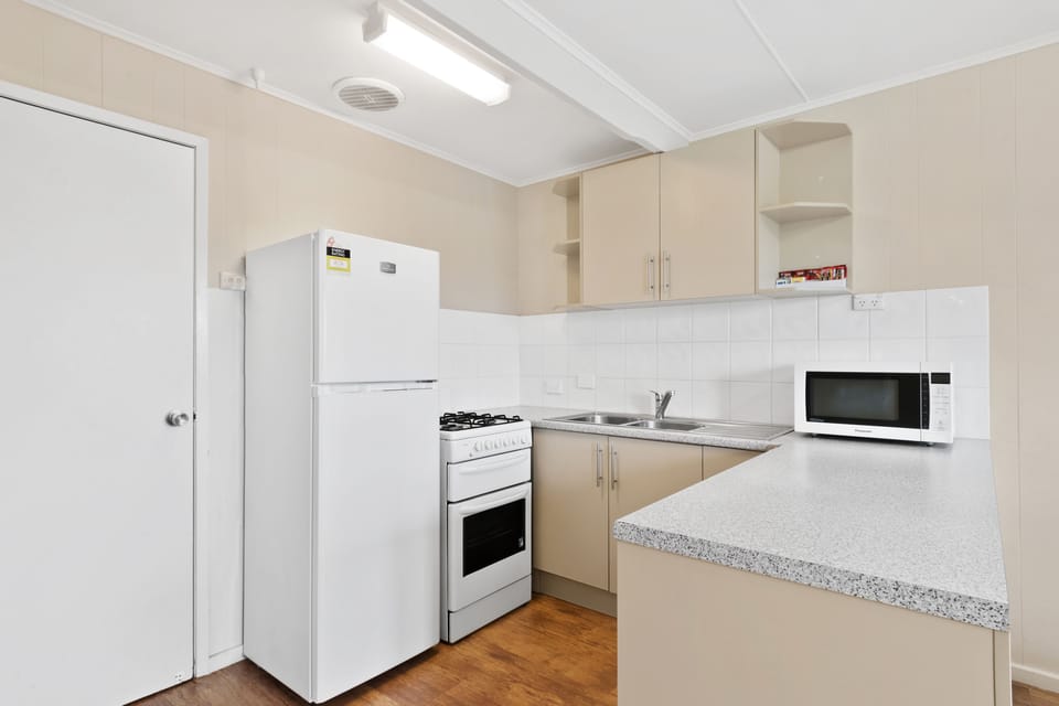 Standard 1 Bedroom Cabin - Sleeps 6 | Private kitchen | Fridge, microwave, cookware/dishes/utensils