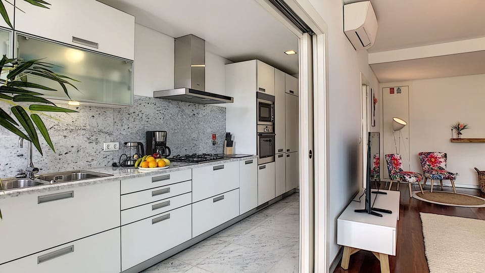 Modern fully equipped kitchen in an open style structure #coffeemachine #AC unit #smartTV