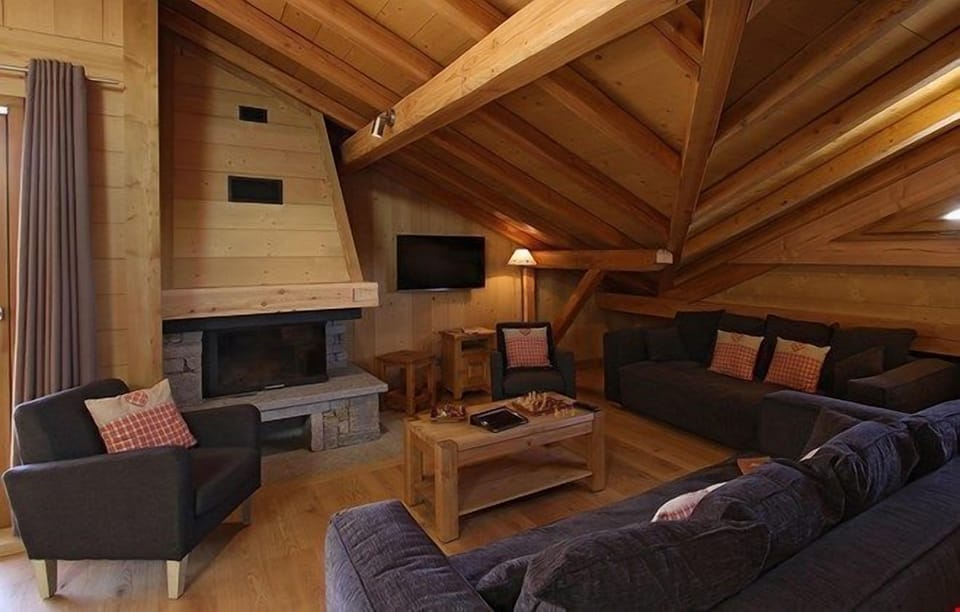 Take a seat in front of the fireplace and enjoy a movie in the living area.